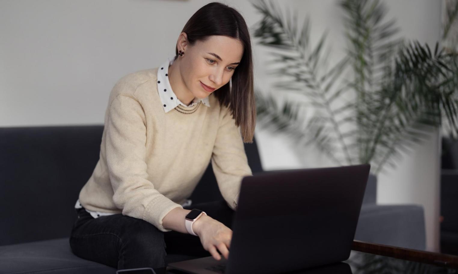 Student using laptop for budget education course with financial planning spreadsheet